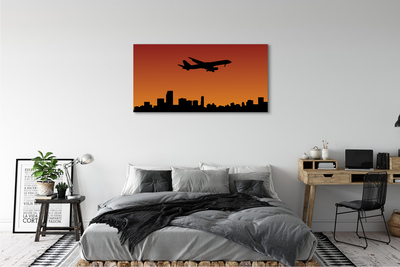 Cuadros sobre lienzo Cielo avión y la puesta del sol