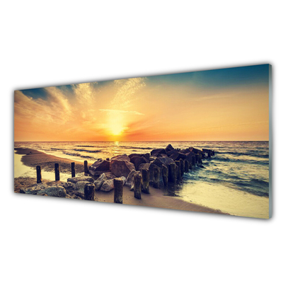 Cuadro en plexiglás Playa rompeolas mar puesta del sol