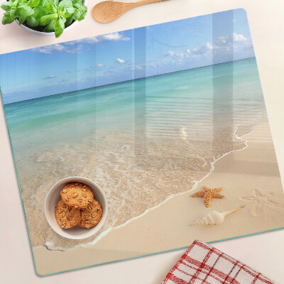 Tabla de cortar de cristal Playa con conchas y olas