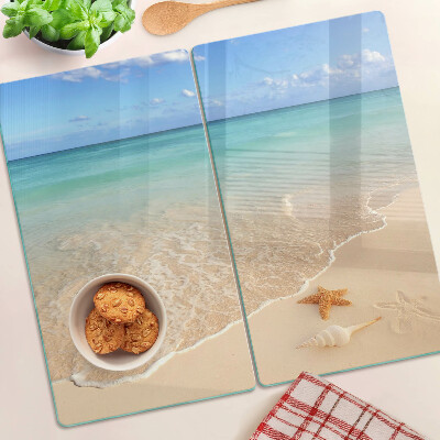 Tabla de cortar de cristal Playa con conchas y olas