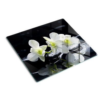 Tabla de cortar de cristal Orquídeas sobre fondo negro