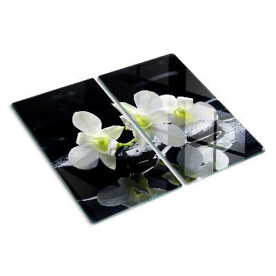 Tabla de cortar de cristal Orquídeas sobre fondo negro