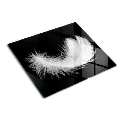 Tabla para cortar Pluma sobre fondo negro
