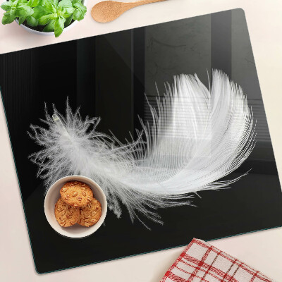 Tabla para cortar Pluma sobre fondo negro
