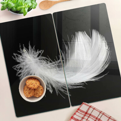 Tabla para cortar Pluma sobre fondo negro