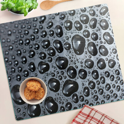 Tabla de cortar de cristal Gotas de agua sobre el vidrio