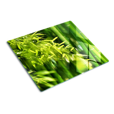 Tabla de cortar de cristal Hojas de bambú y follaje verde.