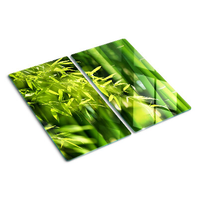 Tabla de cortar de cristal Hojas de bambú y follaje verde.