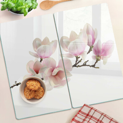 Tabla de cortar de cristal Flores de magnolia en una rama