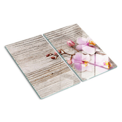 Tabla de cortar de cristal Orquídeas sobre un fondo de madera