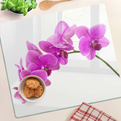 Tabla para cortar Flores de orquídea en tonos rosa.
