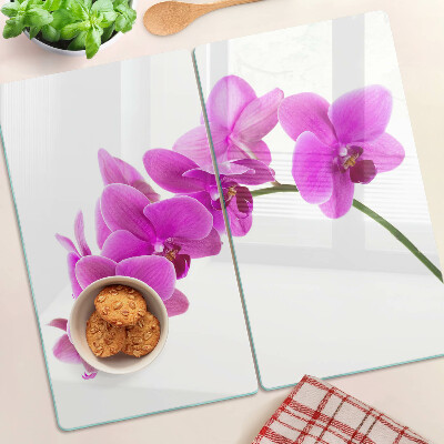 Tabla para cortar Flores de orquídea en tonos rosa.