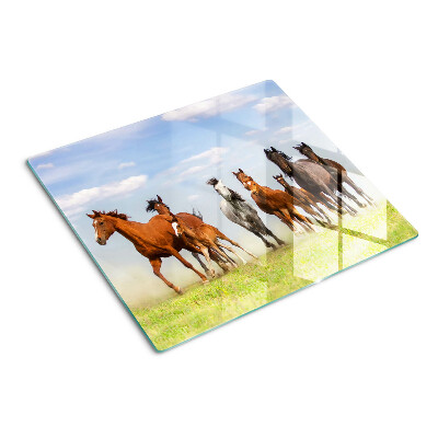 Tabla de cortar de cristal Caballos al galope en el prado