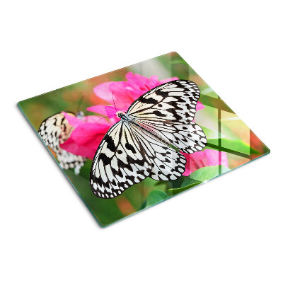 Tabla de cortar de cristal Mariposa sobre flores