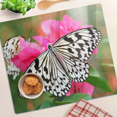Tabla de cortar de cristal Mariposa sobre flores