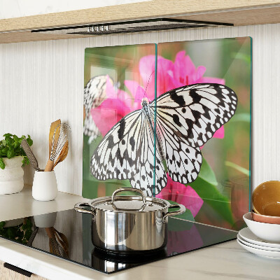 Tabla de cortar de cristal Mariposa sobre flores