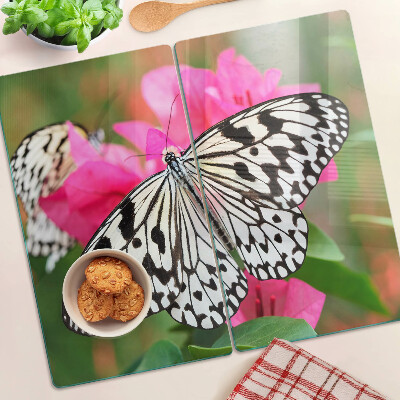 Tabla de cortar de cristal Mariposa sobre flores