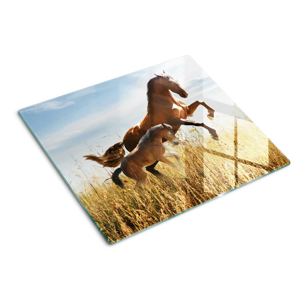 Tabla para cortar Caballos en un prado al sol