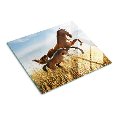 Tabla para cortar Caballos en un prado al sol