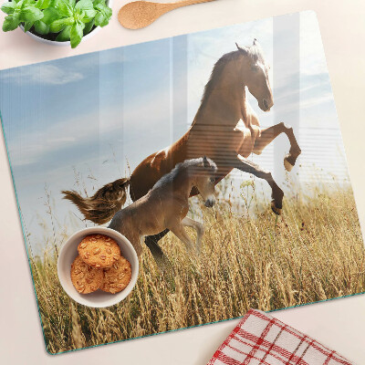 Tabla para cortar Caballos en un prado al sol