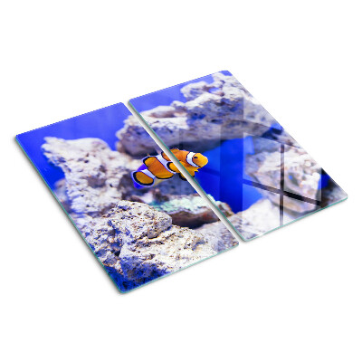 Tabla de cortar de cristal Pez payaso entre las rocas