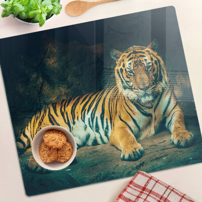 Tabla para cortar Tigre tumbado en las rocas