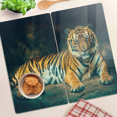 Tabla para cortar Tigre tumbado en las rocas