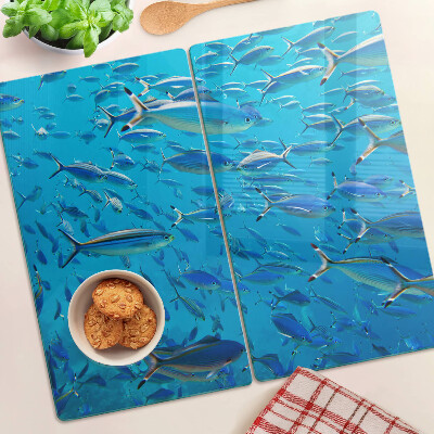 Tabla de cortar de cristal Un banco de peces en agua clara