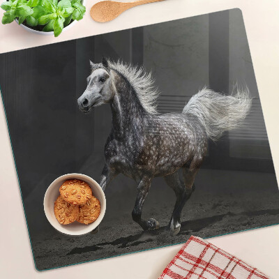 Tabla para cortar Un caballo moteado en fuga