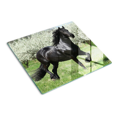 Tabla de cortar de cristal Caballo negro en el prado