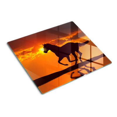 Tabla de cortar de cristal Un caballo con el sol poniente como telón de fondo