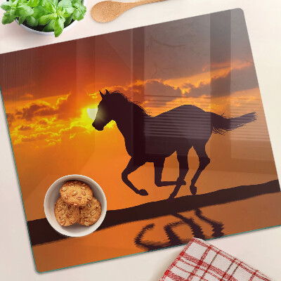 Tabla de cortar de cristal Un caballo con el sol poniente como telón de fondo