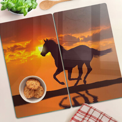 Tabla de cortar de cristal Un caballo con el sol poniente como telón de fondo