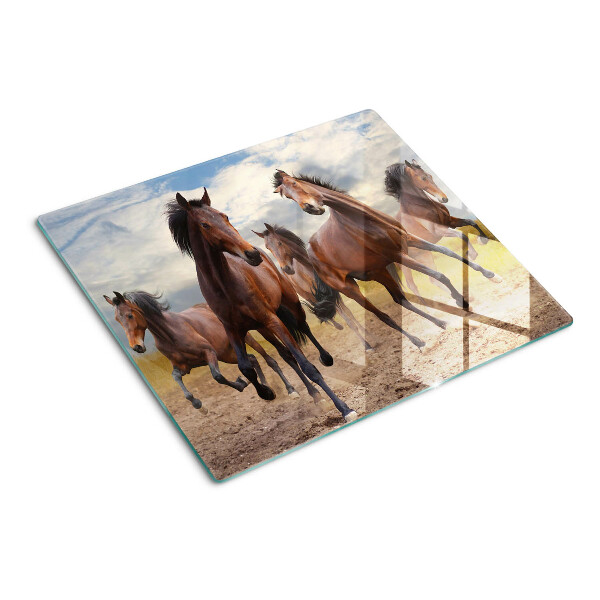 Tabla para cortar Caballos corriendo en el pasto