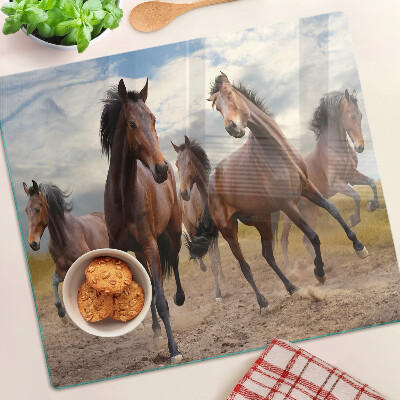 Tabla para cortar Caballos corriendo en el pasto