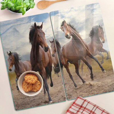 Tabla para cortar Caballos corriendo en el pasto