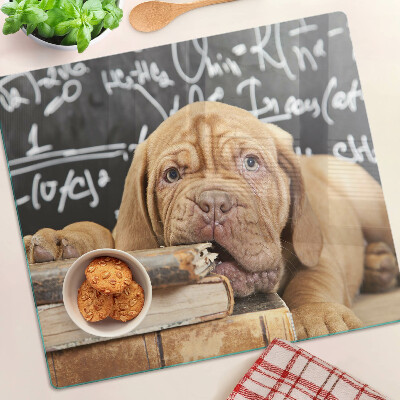 Tabla para cortar Perro con libros y una pizarra.