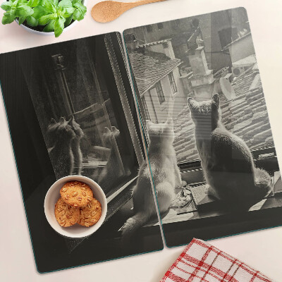 Tabla de cortar de cristal Gatos en la ventana