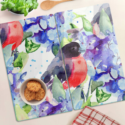 Tabla de cortar de cristal Pájaro sobre un fondo de flores.