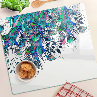 Tabla de cortar de cristal Plumas de pavo real en colores verde y azul.