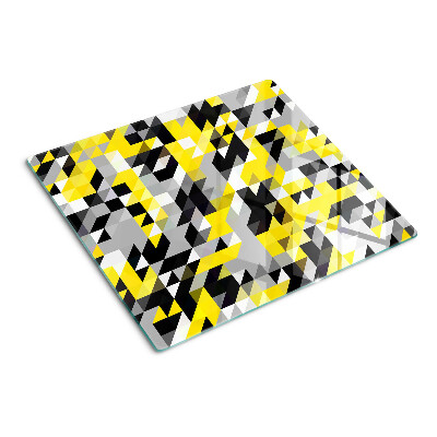 Tabla para cortar Geometría en tonos amarillos y negros.