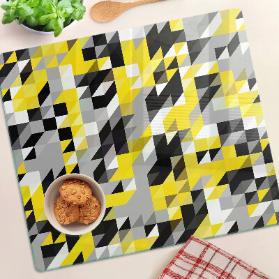 Tabla para cortar Geometría en tonos amarillos y negros.