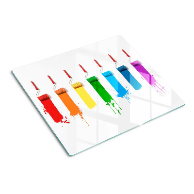 Tabla para cortar Un arcoíris de pinturas en pinceles.