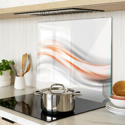 Tabla de cortar de cristal Ondas en tonos naranja y gris.