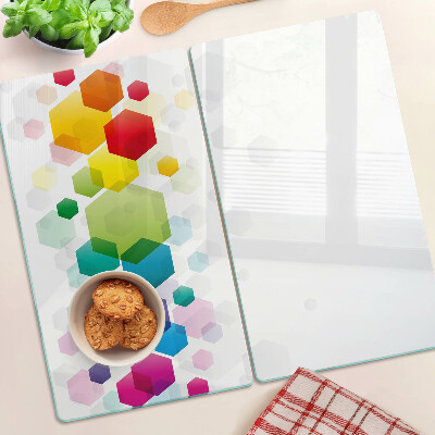 Tabla para cortar Hexágonos coloridos en el fondo.