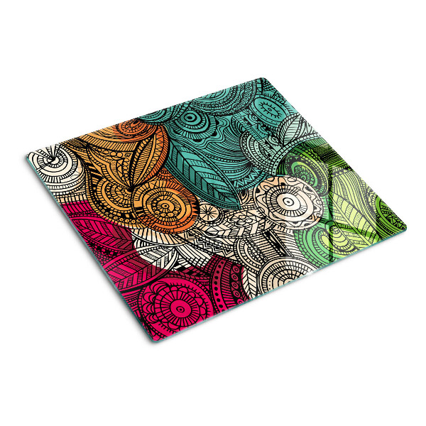 Tabla de cortar de cristal Motivo de mandala con patrones coloridos.