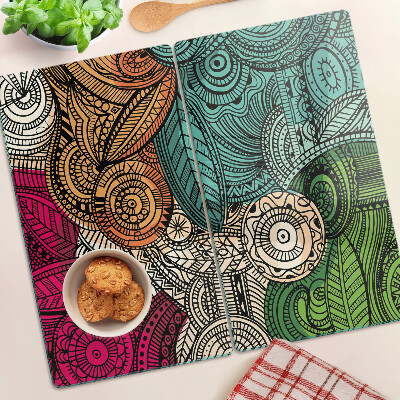 Tabla de cortar de cristal Motivo de mandala con patrones coloridos.