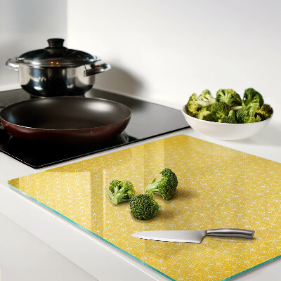 Tabla para cortar Flor de la vida sobre fondo amarillo