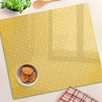 Tabla para cortar Flor de la vida sobre fondo amarillo