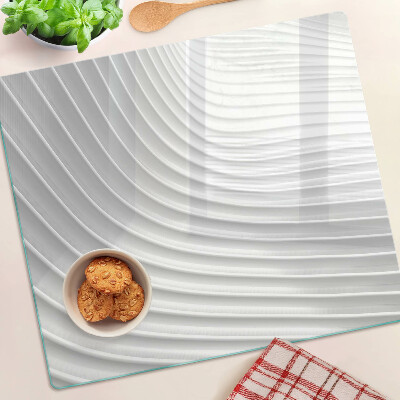 Tabla de cortar de cristal Ondas y líneas en tonos de gris.